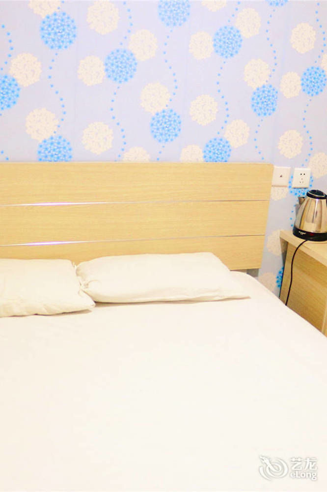 Qingdao Peninsula Four Seasons Business Hotel Экстерьер фото
